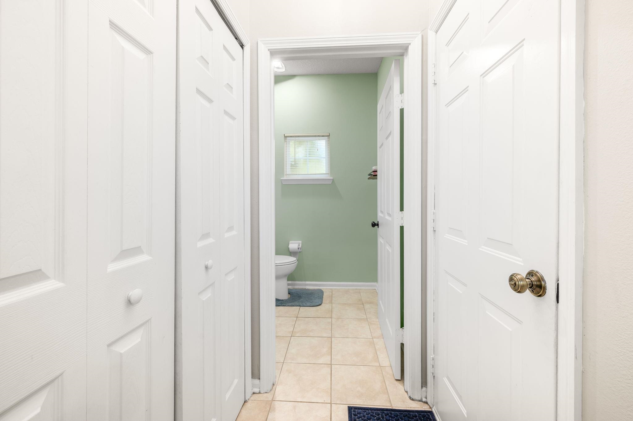 7990 Baymeadows Road East, Unit 1308 Jacksonville, FL 32256 - Photo 16 of 45 a bathroom with a glass shower door