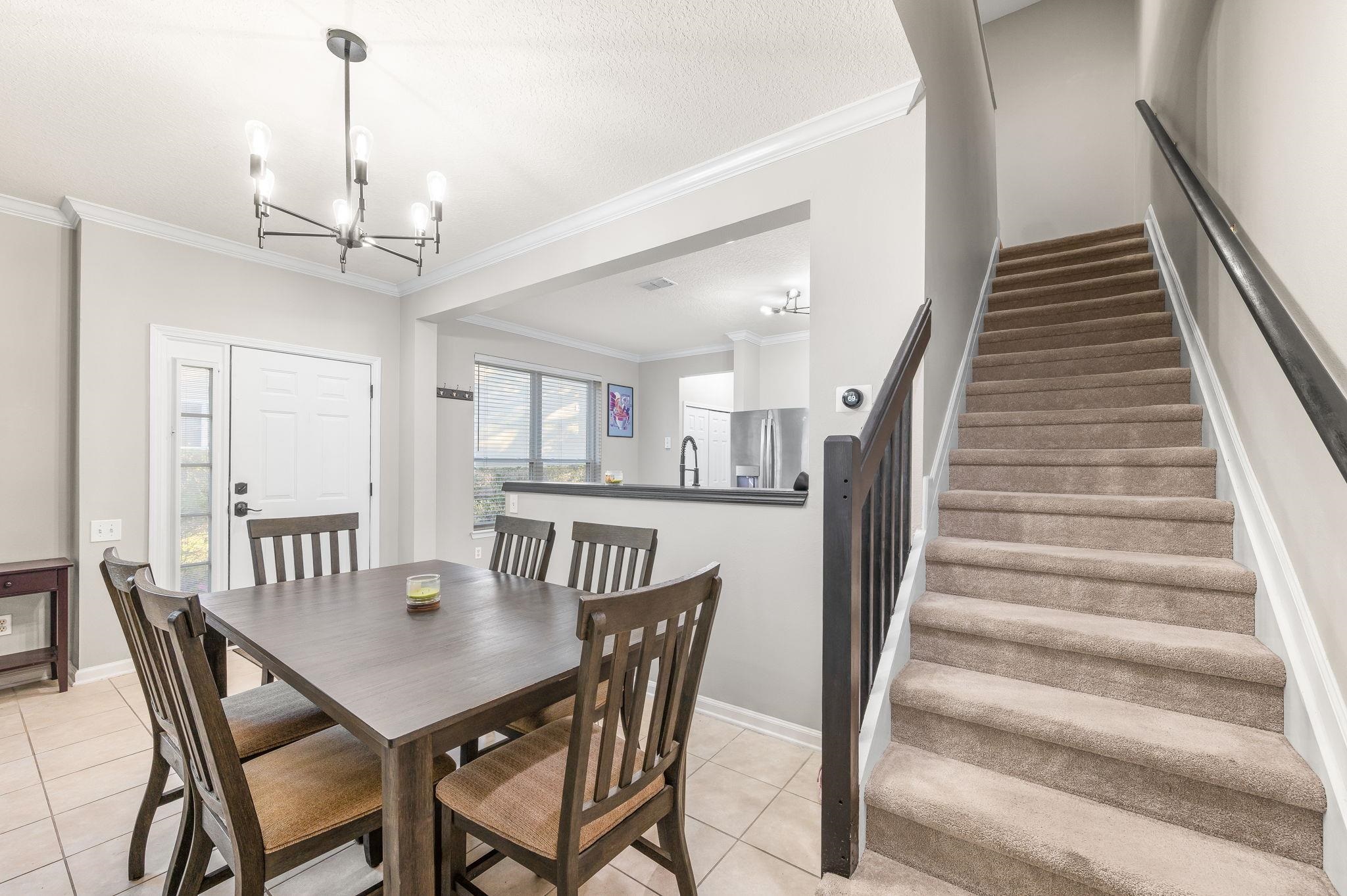 7990 Baymeadows Road East, Unit 1308 Jacksonville, FL 32256 - Photo 18 of 45 a view of a dining room with furniture and wooden floor
