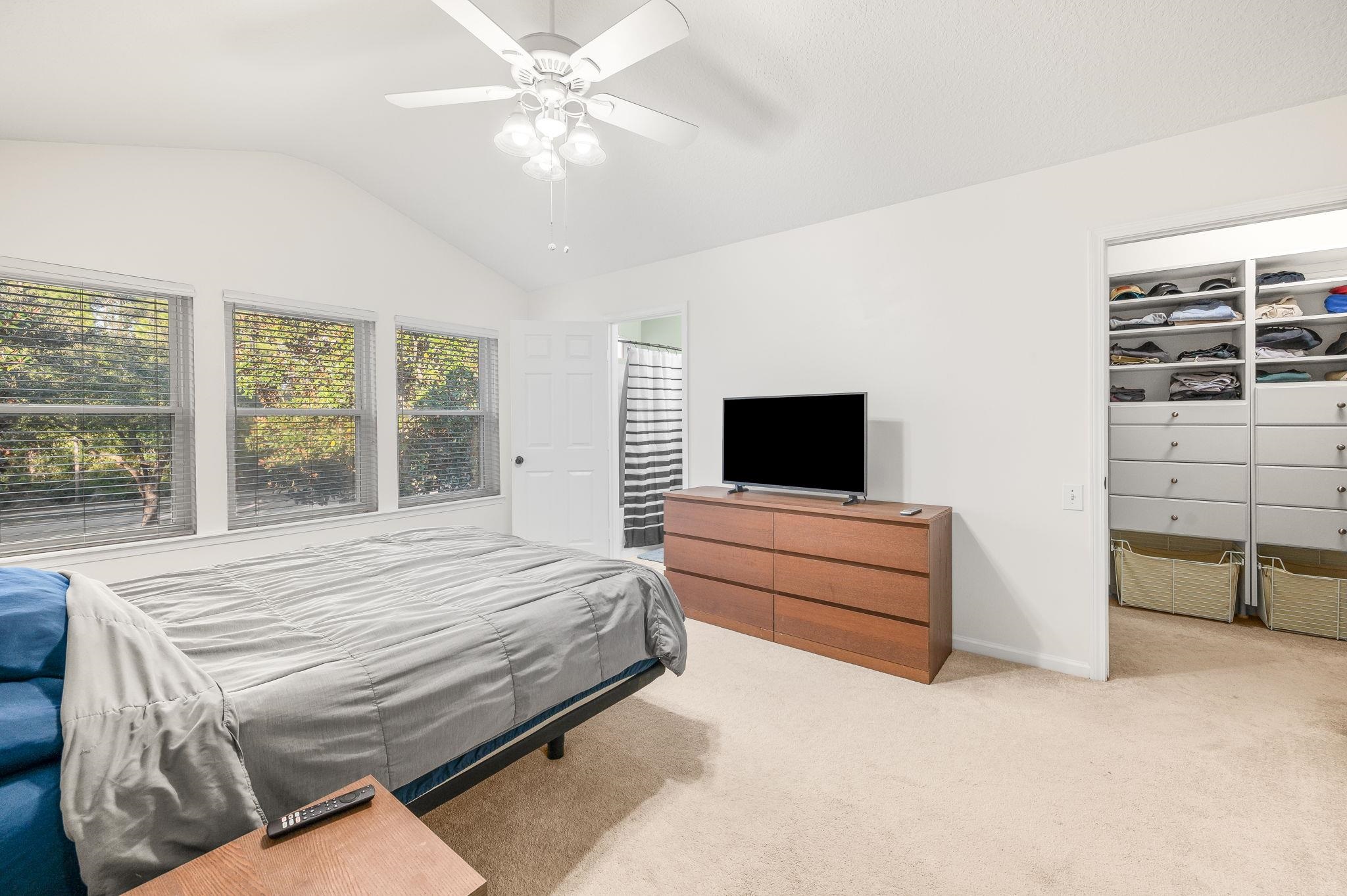 7990 Baymeadows Road East, Unit 1308 Jacksonville, FL 32256 - Photo 21 of 45 a bedroom with a bed and a flat screen tv