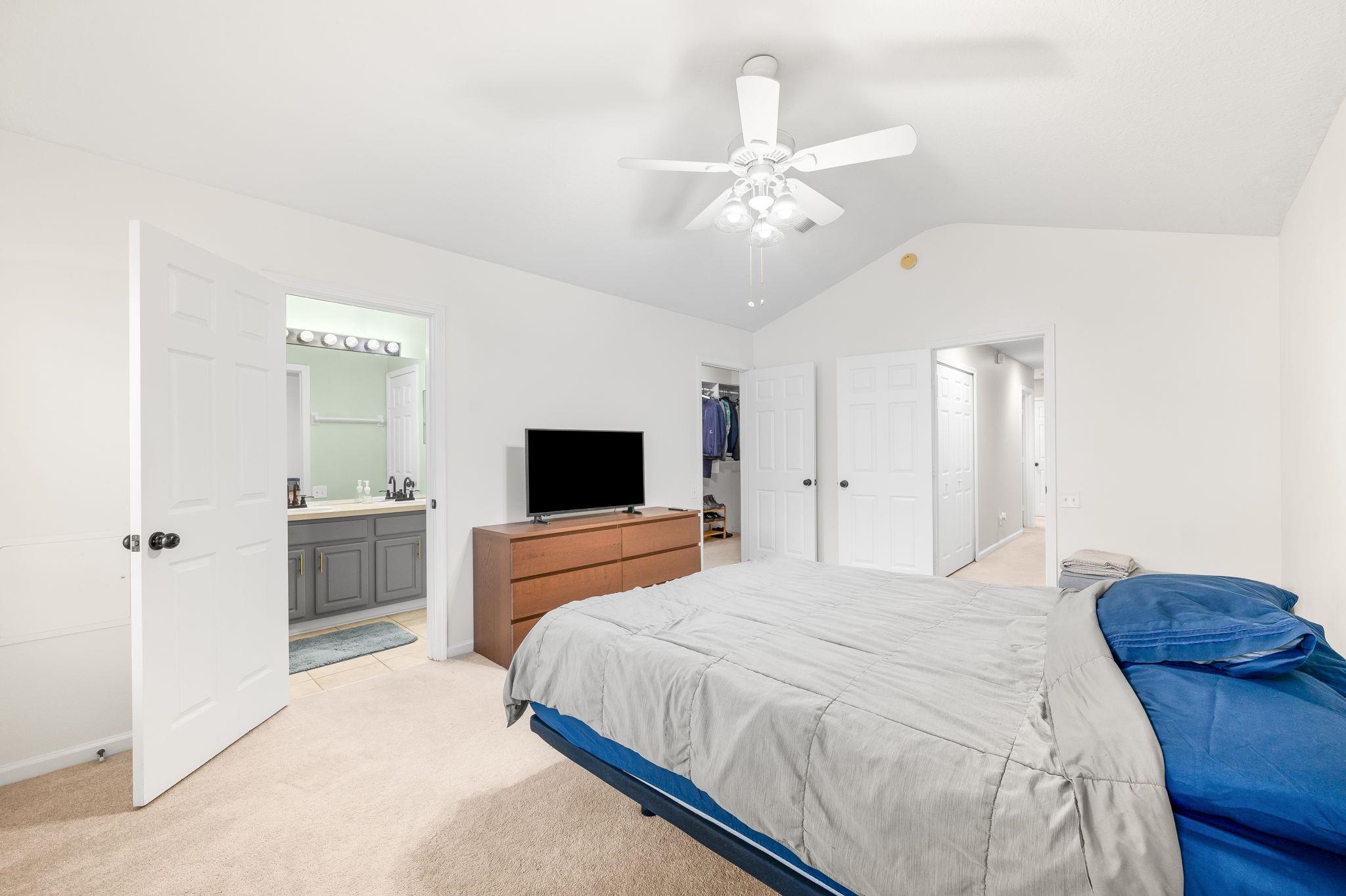 7990 Baymeadows Road East, Unit 1308 Jacksonville, FL 32256 - Photo 22 of 45 a bedroom with a bed and a flat screen tv