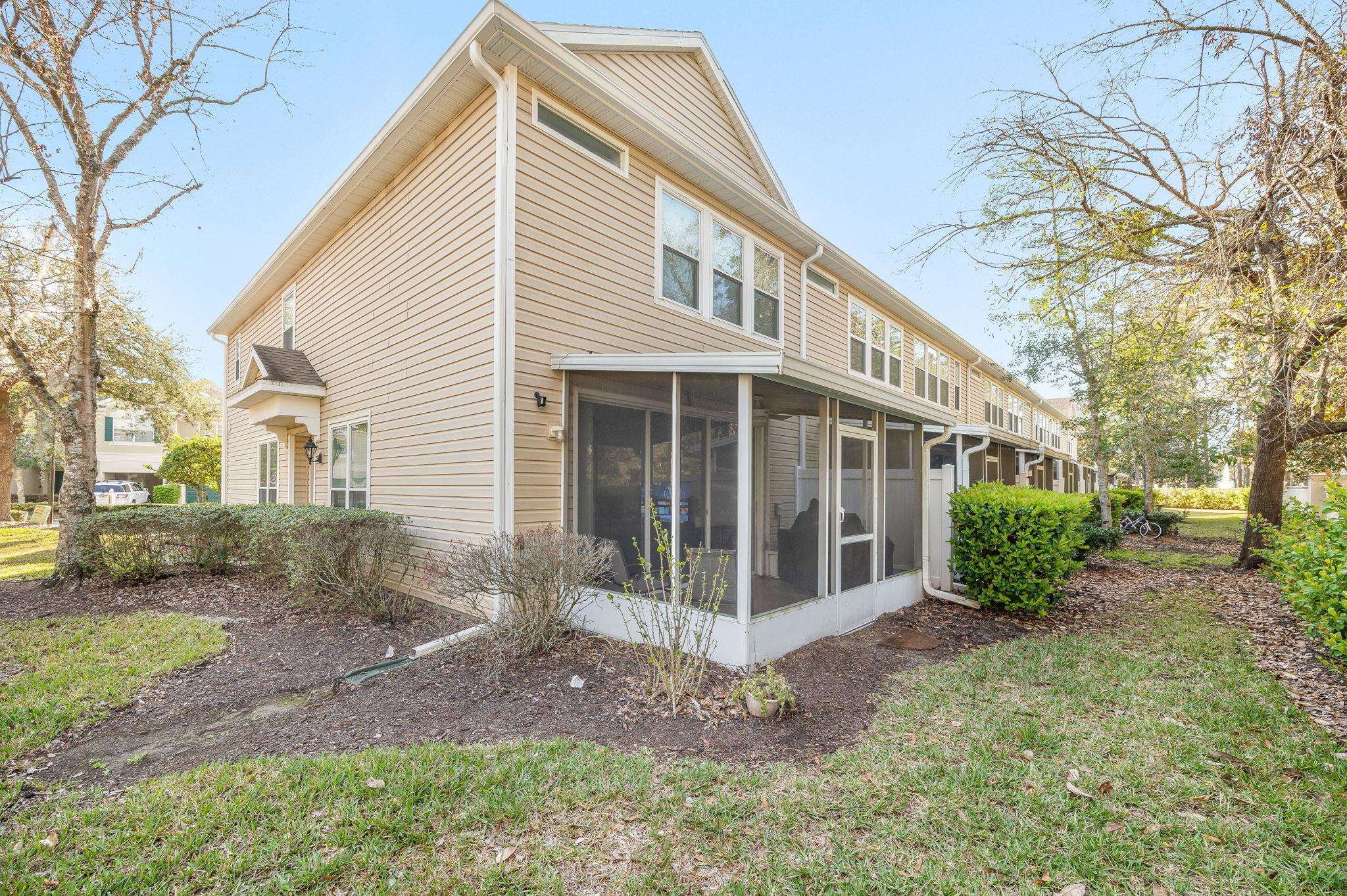 7990 Baymeadows Road East, Unit 1308 Jacksonville, FL 32256 - Photo 37 of 45 a view of a house with a yard