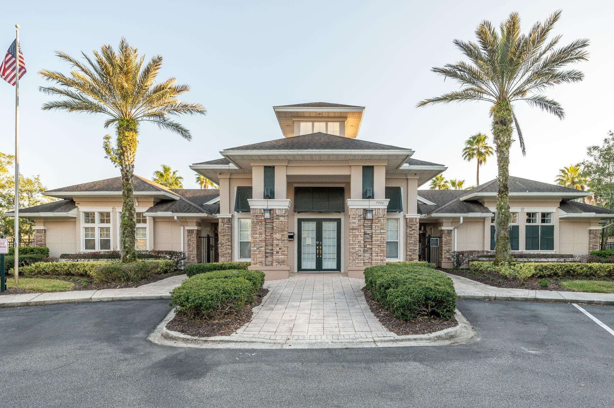 7990 Baymeadows Road East, Unit 1308 Jacksonville, FL 32256 - Photo 41 of 45 a front view of a house with a yard and garage