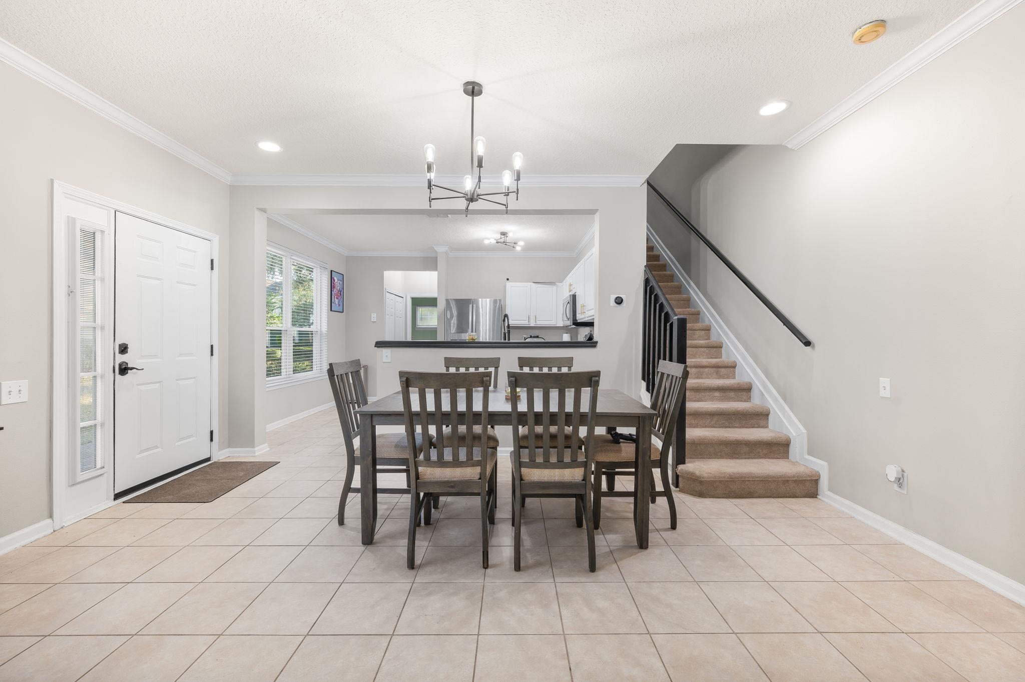 7990 Baymeadows Road East, Unit 1308 Jacksonville, FL 32256 - Photo 8 of 45 a view of a dining room with furniture