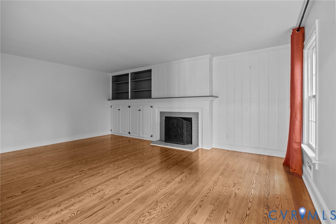 4717 Southmoor Road North Chesterfield, VA 23234 - Photo 11 of 50 a view of empty room with wooden floor and fireplace