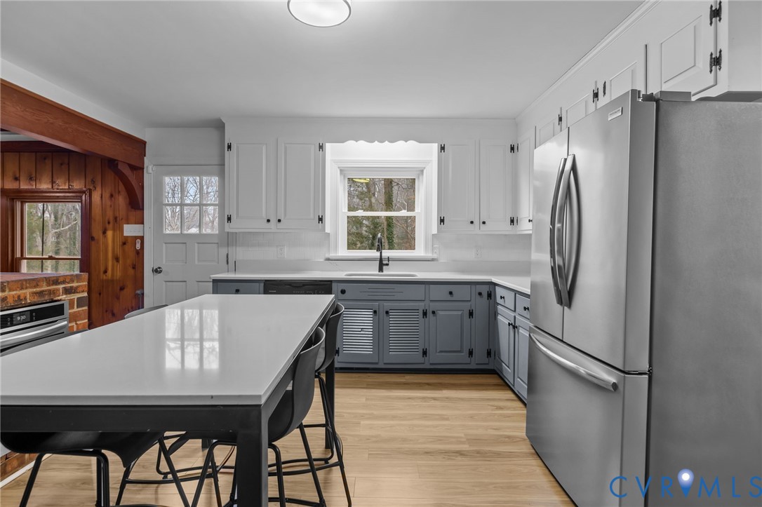 4717 Southmoor Road North Chesterfield, VA 23234 - Photo 17 of 50 a kitchen with stainless steel appliances granite countertop a refrigerator sink and stove