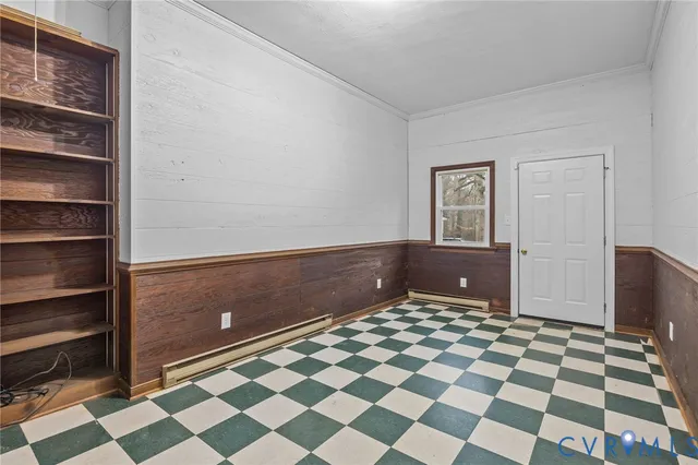 a view of an empty room and a window