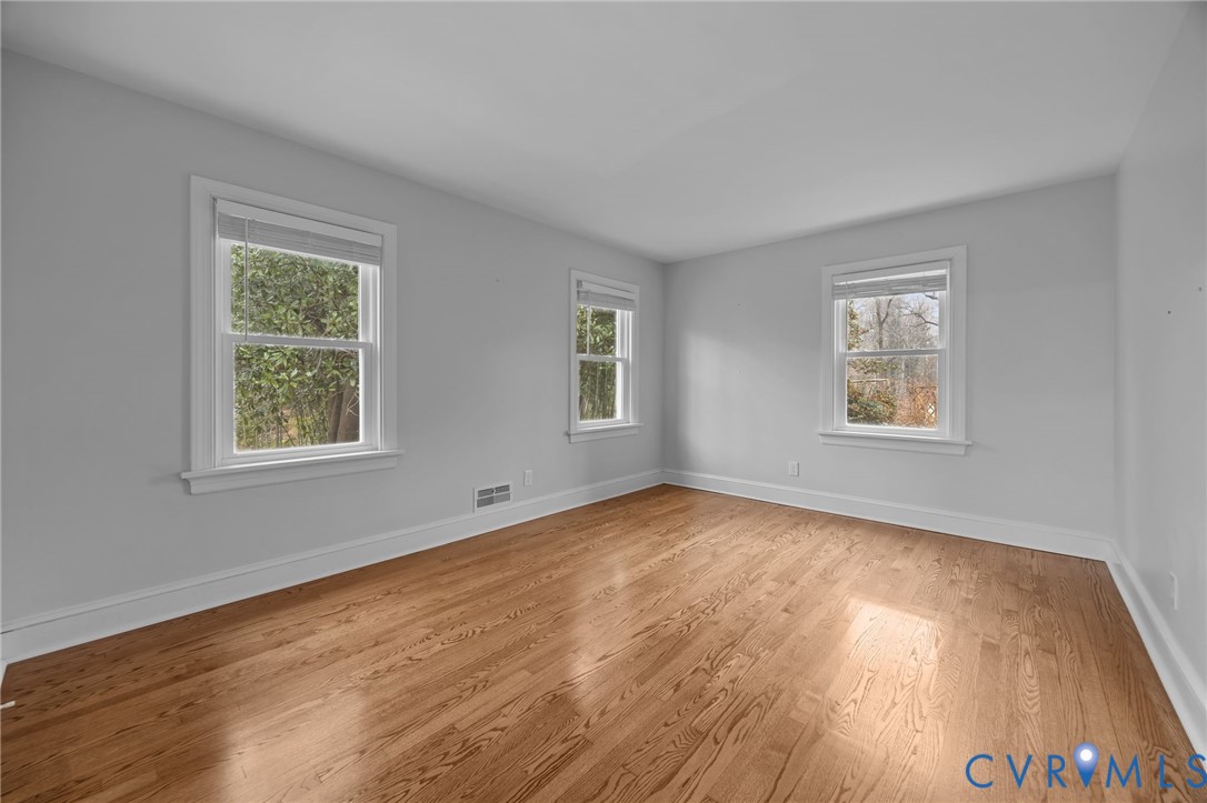 4717 Southmoor Road North Chesterfield, VA 23234 - Photo 24 of 50 a view of an empty room with wooden floor and a window