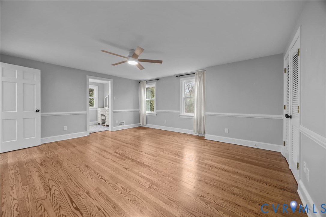 4717 Southmoor Road North Chesterfield, VA 23234 - Photo 29 of 50 a view of empty room with wooden floor and fan