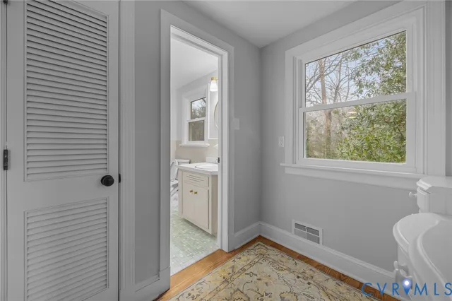 a view of room with window and hallway