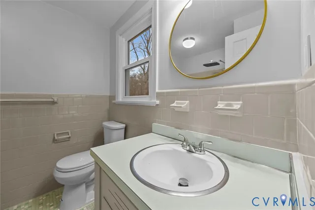 a bathroom with a sink and mirror