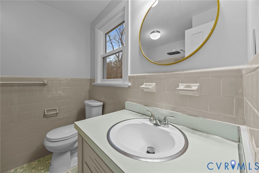 4717 Southmoor Road North Chesterfield, VA 23234 - Photo 32 of 50 a bathroom with a sink and mirror