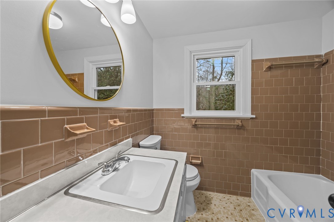 4717 Southmoor Road North Chesterfield, VA 23234 - Photo 33 of 50 a bathroom with a toilet a sink and mirror