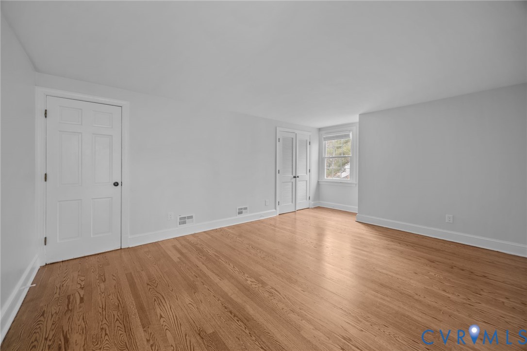 4717 Southmoor Road North Chesterfield, VA 23234 - Photo 35 of 50 a view of empty room with wooden floor and fan