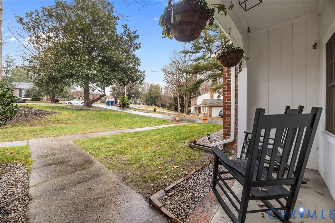 4717 Southmoor Road North Chesterfield, VA 23234 - Photo 7 of 50 a view of a patio with table and chairs potted plants and large tree