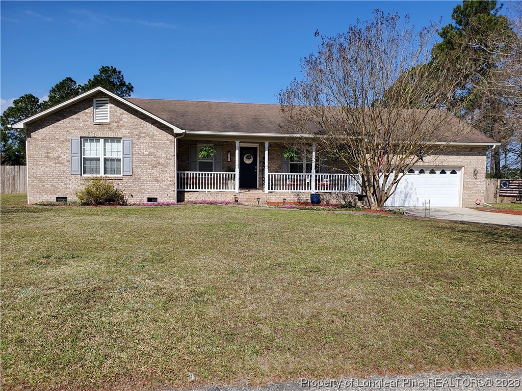 563 Sawyer Road Cameron, NC 28326 - Photo 1 of 43 a front view of a house with a yard
