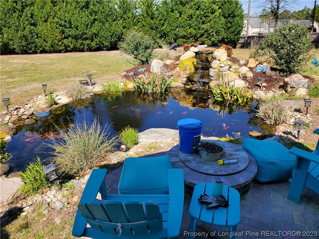 563 Sawyer Road Cameron, NC 28326 - Photo 12 of 43 a view of a chairs and table in a yard