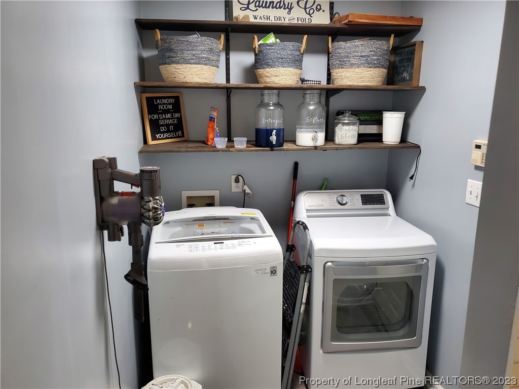 563 Sawyer Road Cameron, NC 28326 - Photo 21 of 43 a utility room with dryer and washer