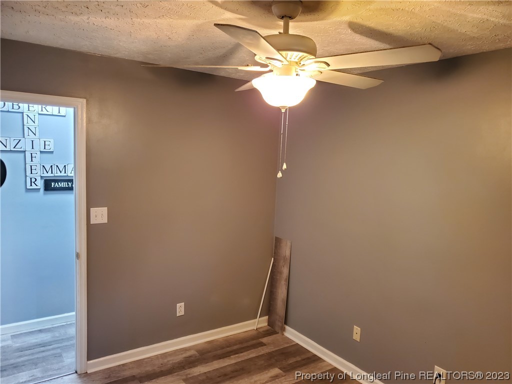 563 Sawyer Road Cameron, NC 28326 - Photo 27 of 43 wooden floor in an empty room with a window