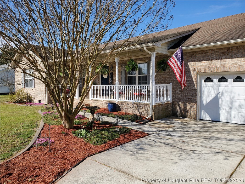 563 Sawyer Road Cameron, NC 28326 - Photo 3 of 43 a view of a backyard with a garden