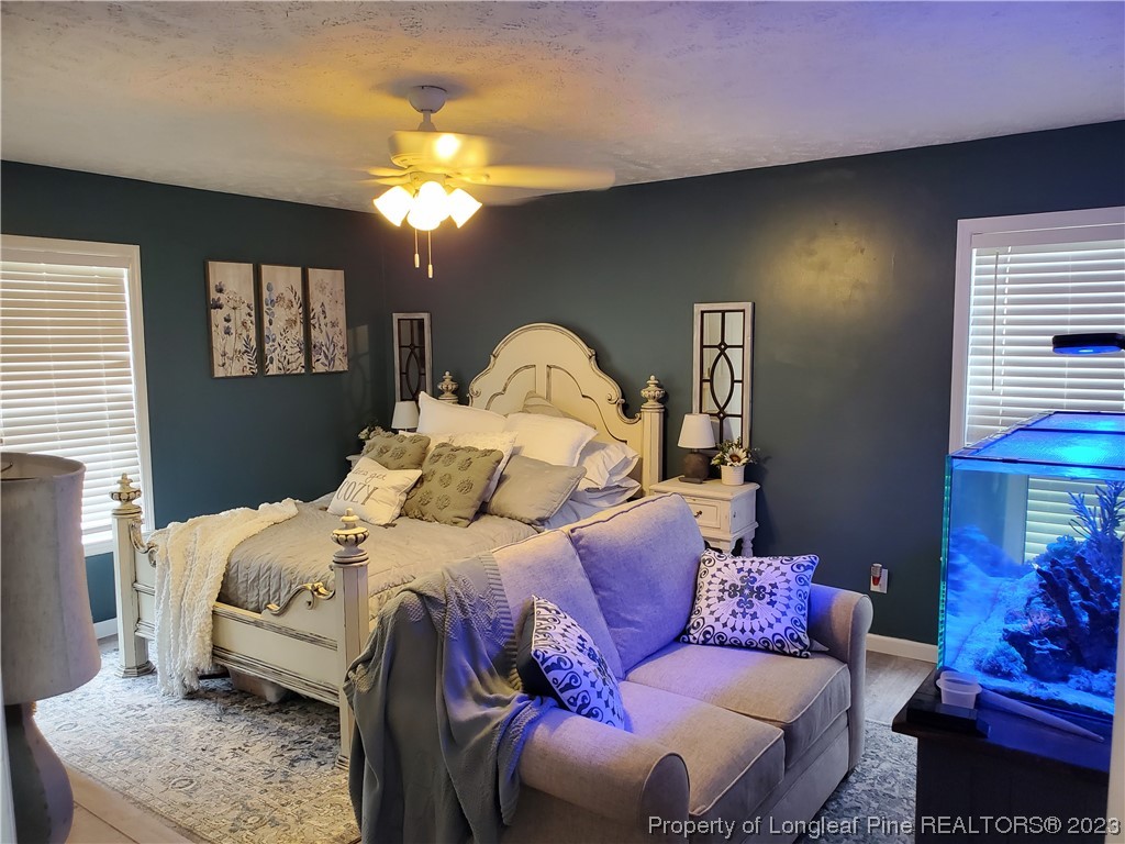 563 Sawyer Road Cameron, NC 28326 - Photo 31 of 43 a bedroom with a bed and window