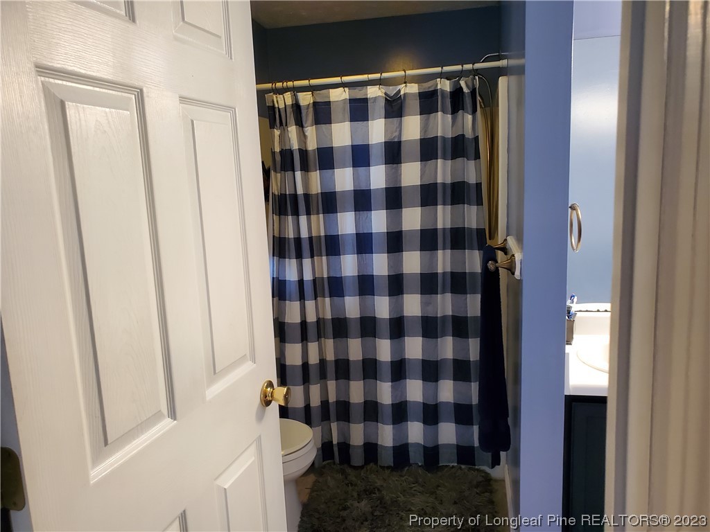 563 Sawyer Road Cameron, NC 28326 - Photo 32 of 43 a bathroom with a bathtub and shower