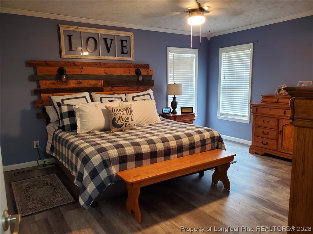 563 Sawyer Road Cameron, NC 28326 - Photo 35 of 43 a bedroom with a bed and a dresser