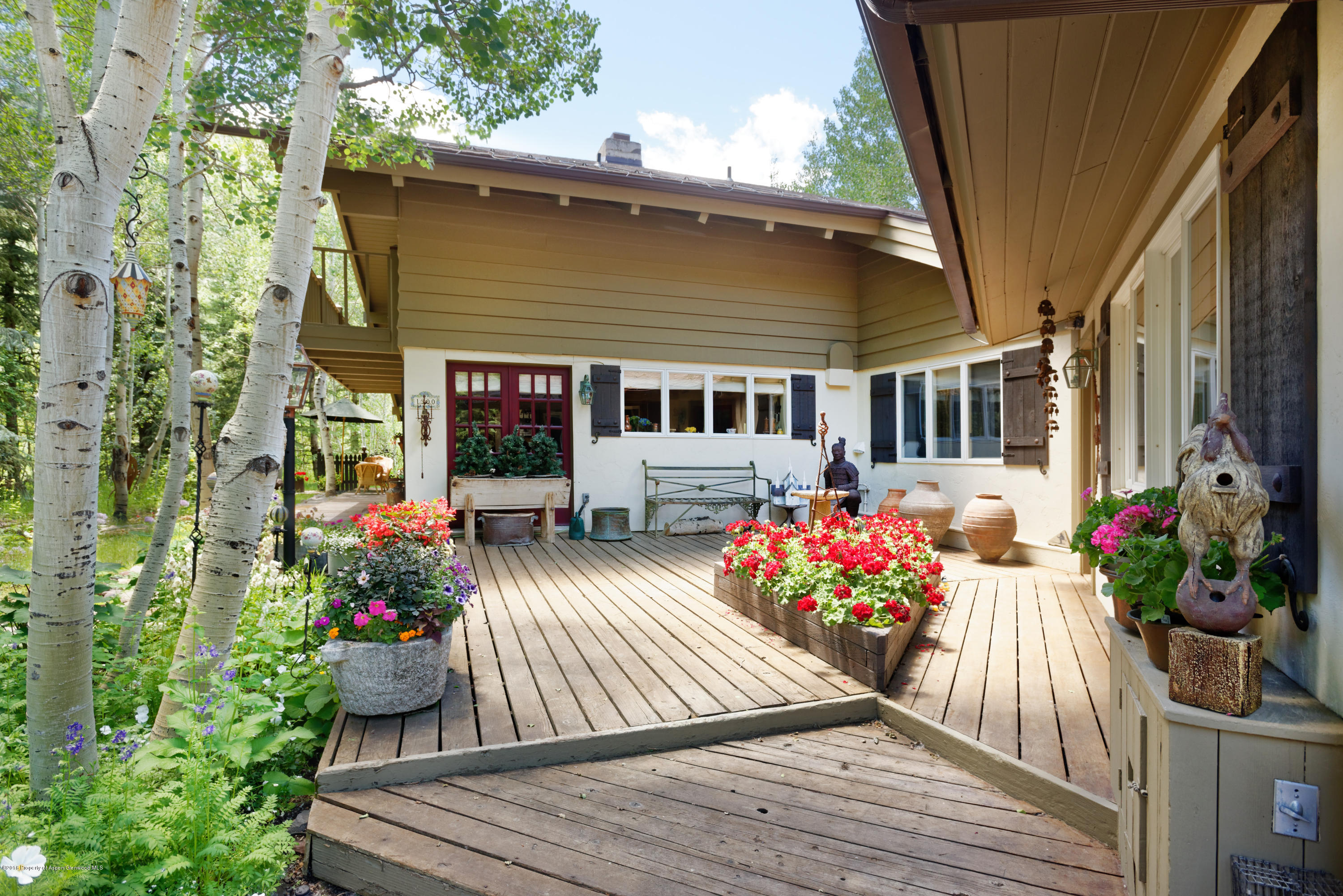 a view of a house with wooden deck