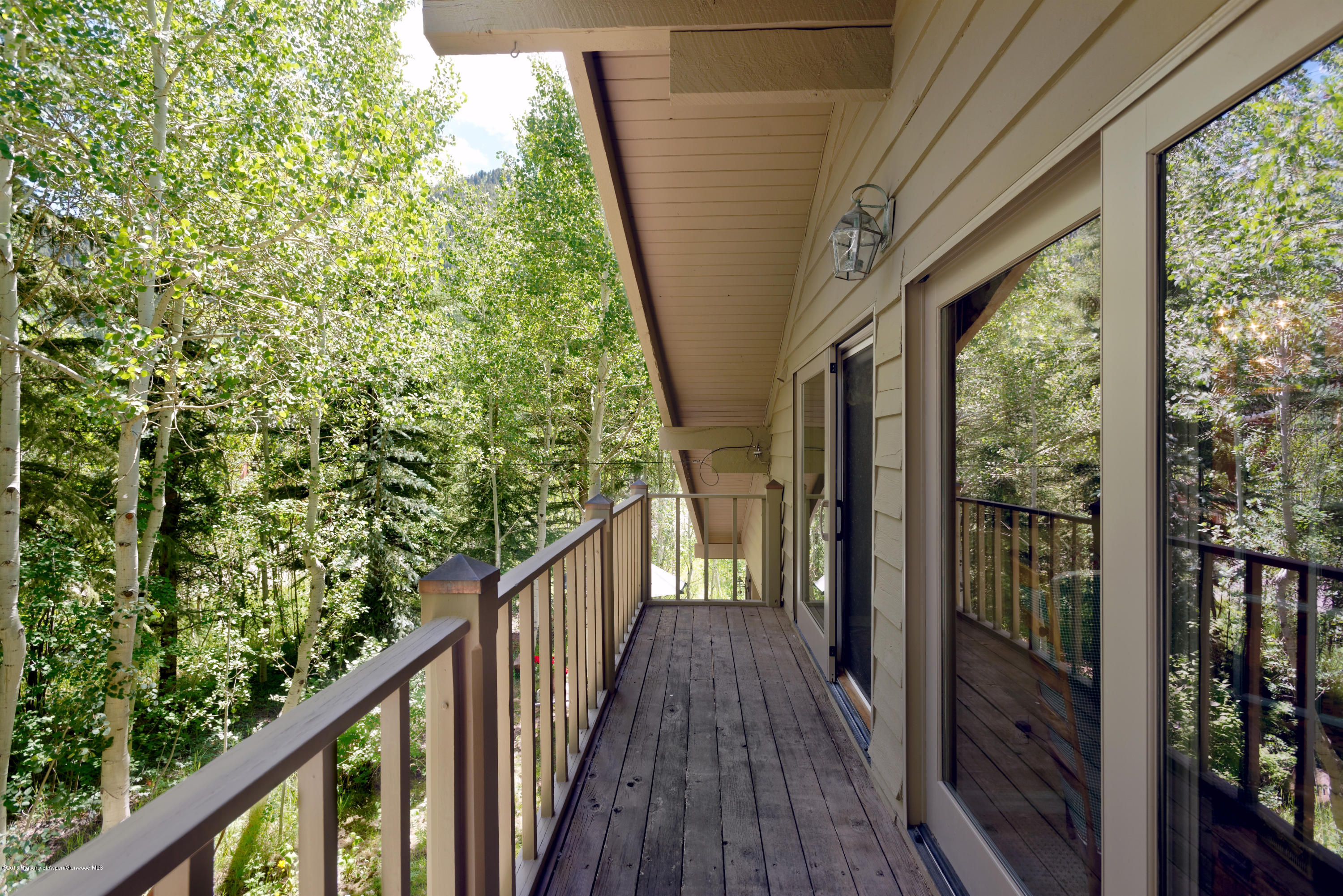 1300 Riverside Drive Aspen, CO 81611 - Photo 13 of 24 a view of a balcony with wooden floor