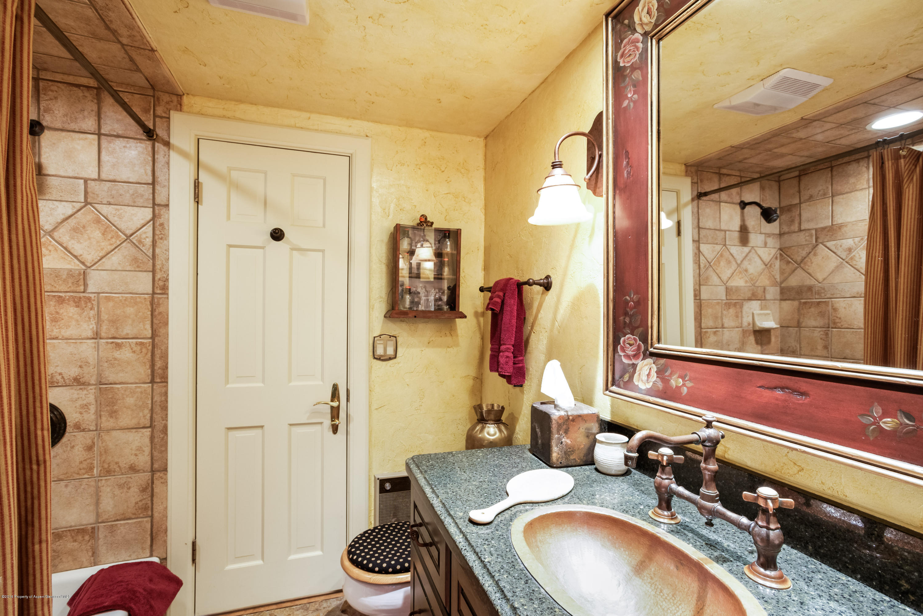 1300 Riverside Drive Aspen, CO 81611 - Photo 16 of 24 a bathroom with a granite countertop sink and a mirror