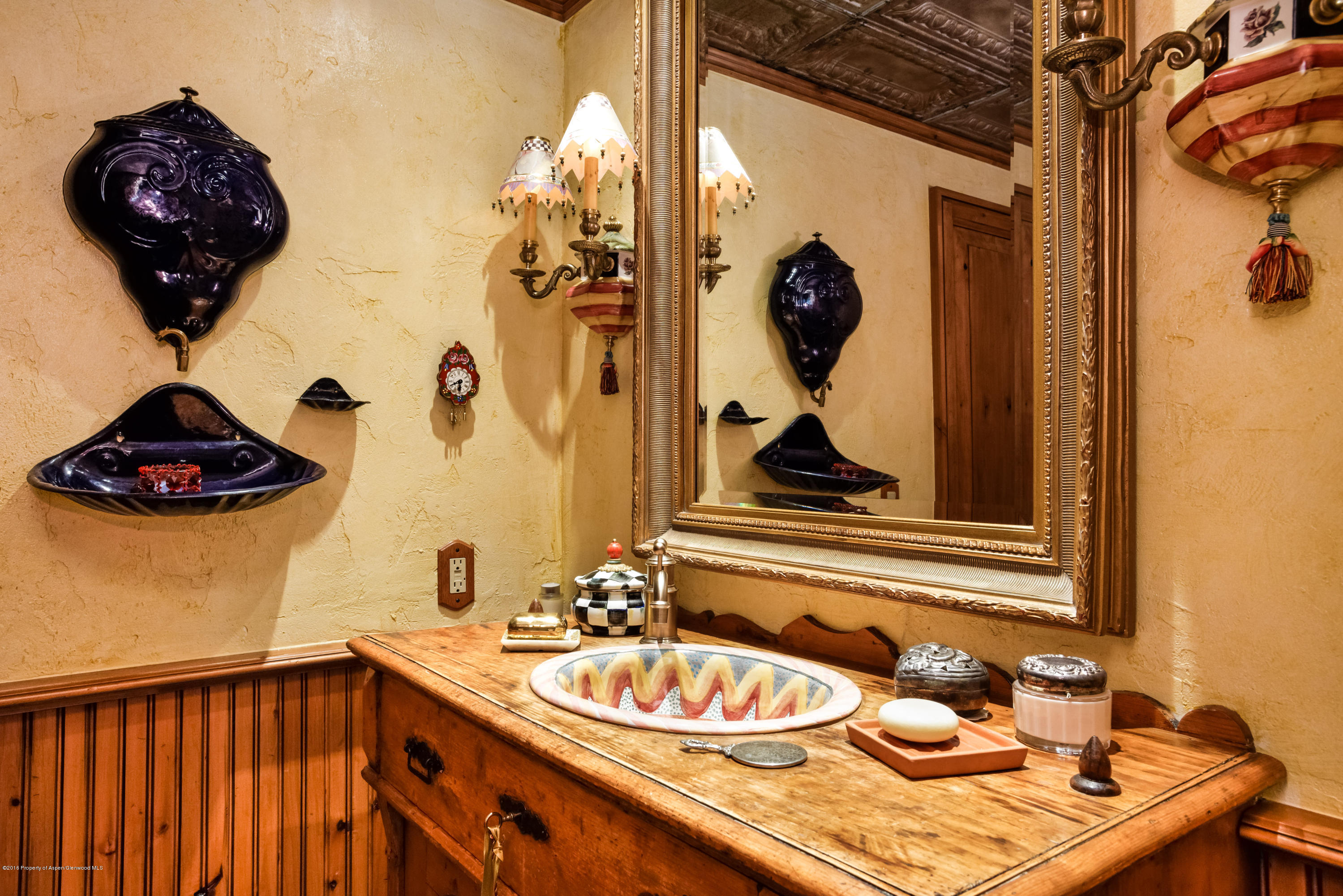 1300 Riverside Drive Aspen, CO 81611 - Photo 18 of 24 a bathroom with a sink and a mirror
