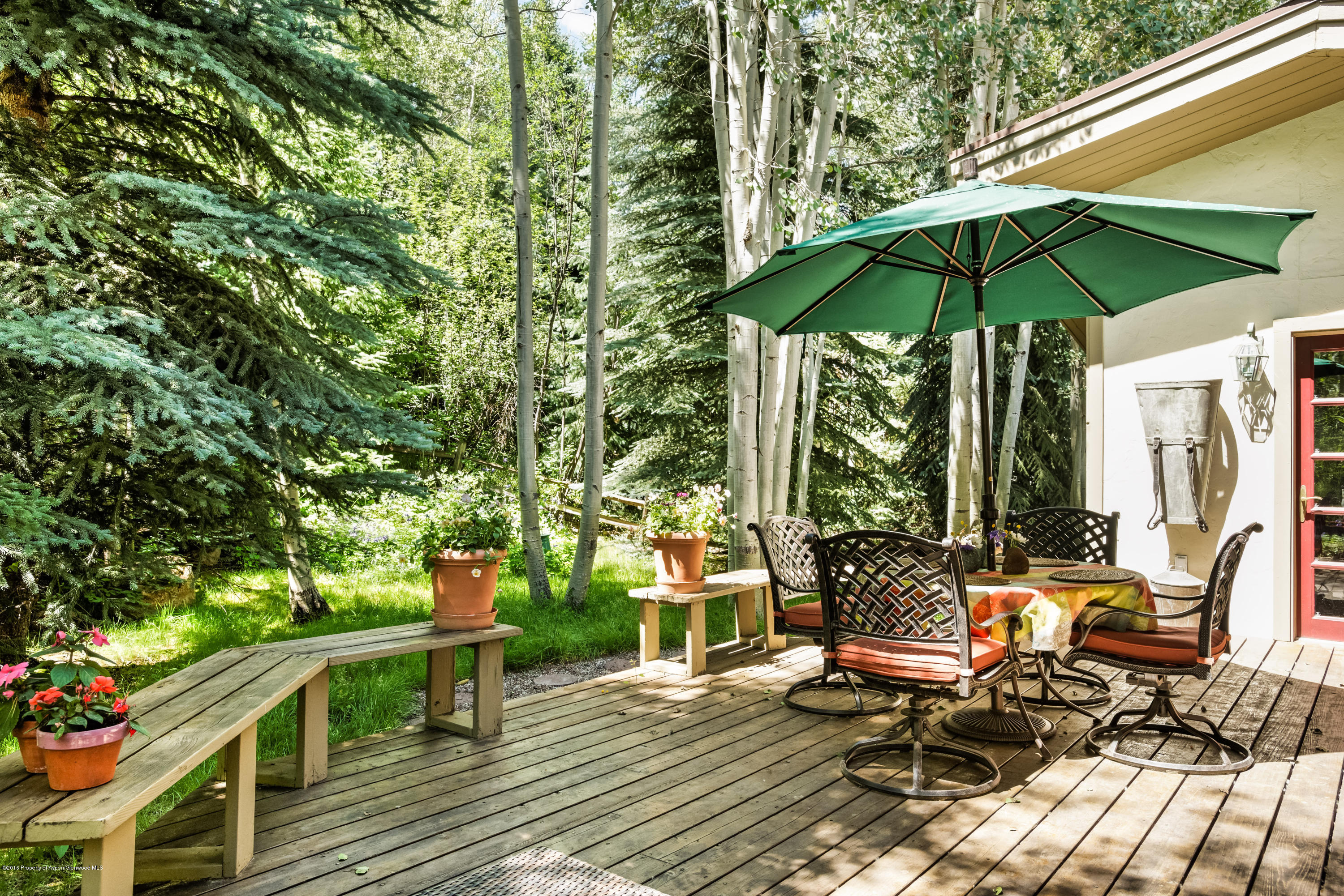1300 Riverside Drive Aspen, CO 81611 - Photo 20 of 24 a view of chair and tables in the patio