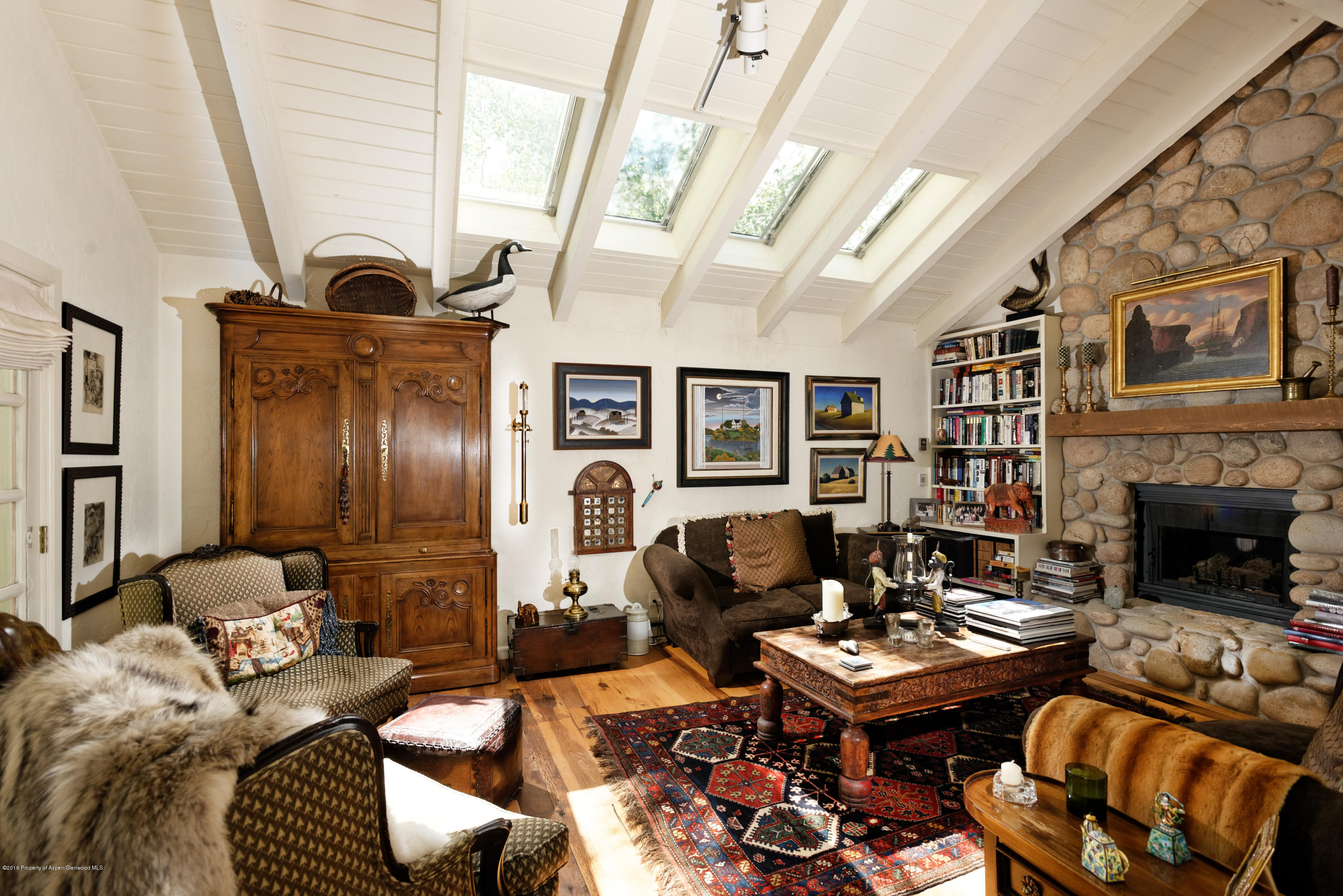 1300 Riverside Drive Aspen, CO 81611 - Photo 4 of 24 a living room with furniture and fireplace