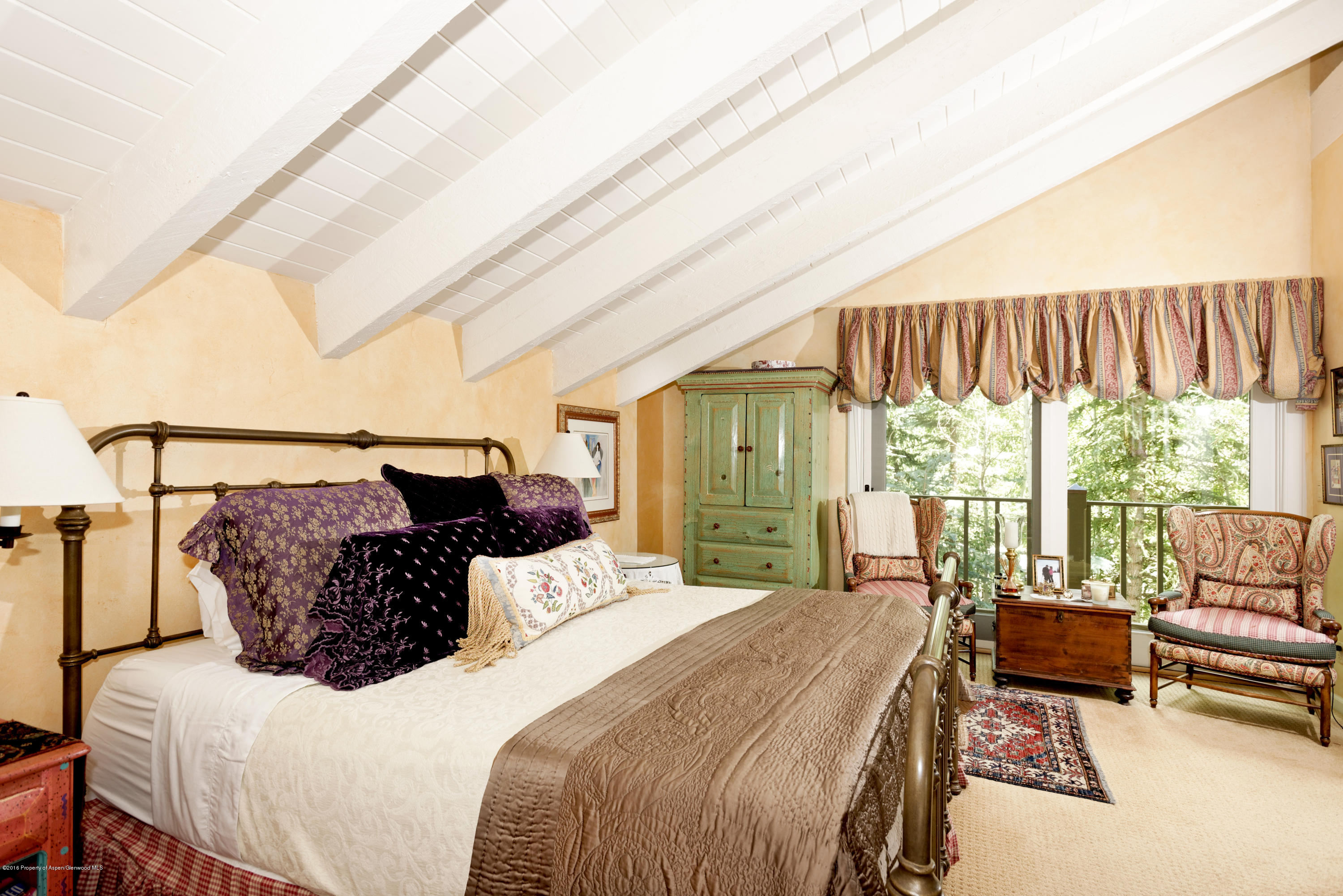 1300 Riverside Drive Aspen, CO 81611 - Photo 9 of 24 a bedroom with a bed and a couch