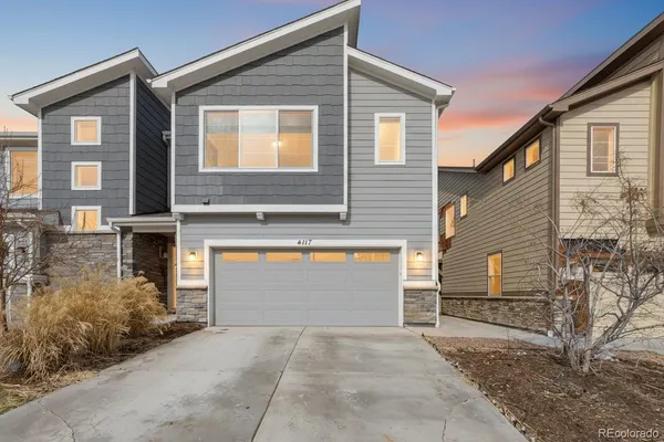 a front view of a house with garage