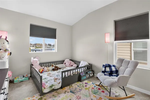 a bedroom with furniture and a window