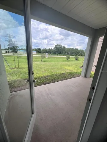 a view of porch with a swimming pool