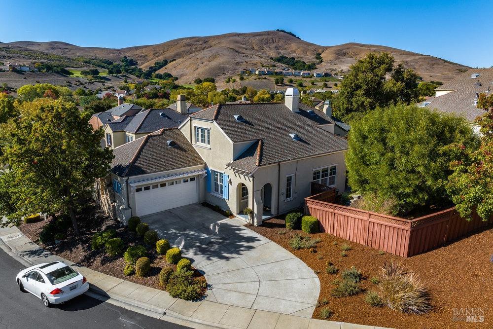 an aerial view of a house with a garden