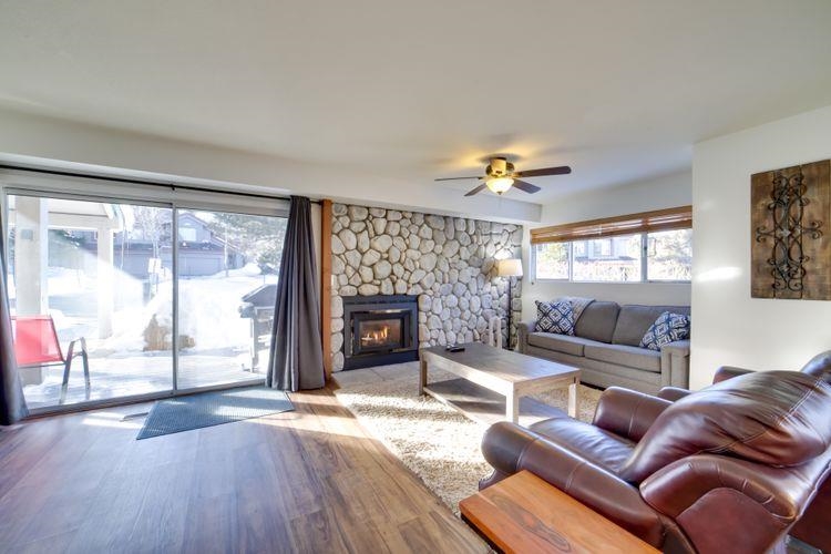 591 Golden Creek Road, Unit 591 Mammoth Lakes, CA 93546 - Photo 4 of 19 a living room with furniture a fireplace and a flat screen tv