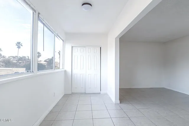 a view of an empty room and window