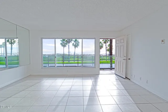a view of empty room with windows