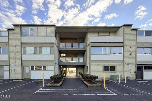 a view of a glass door with a floor to ceiling window next to a yard