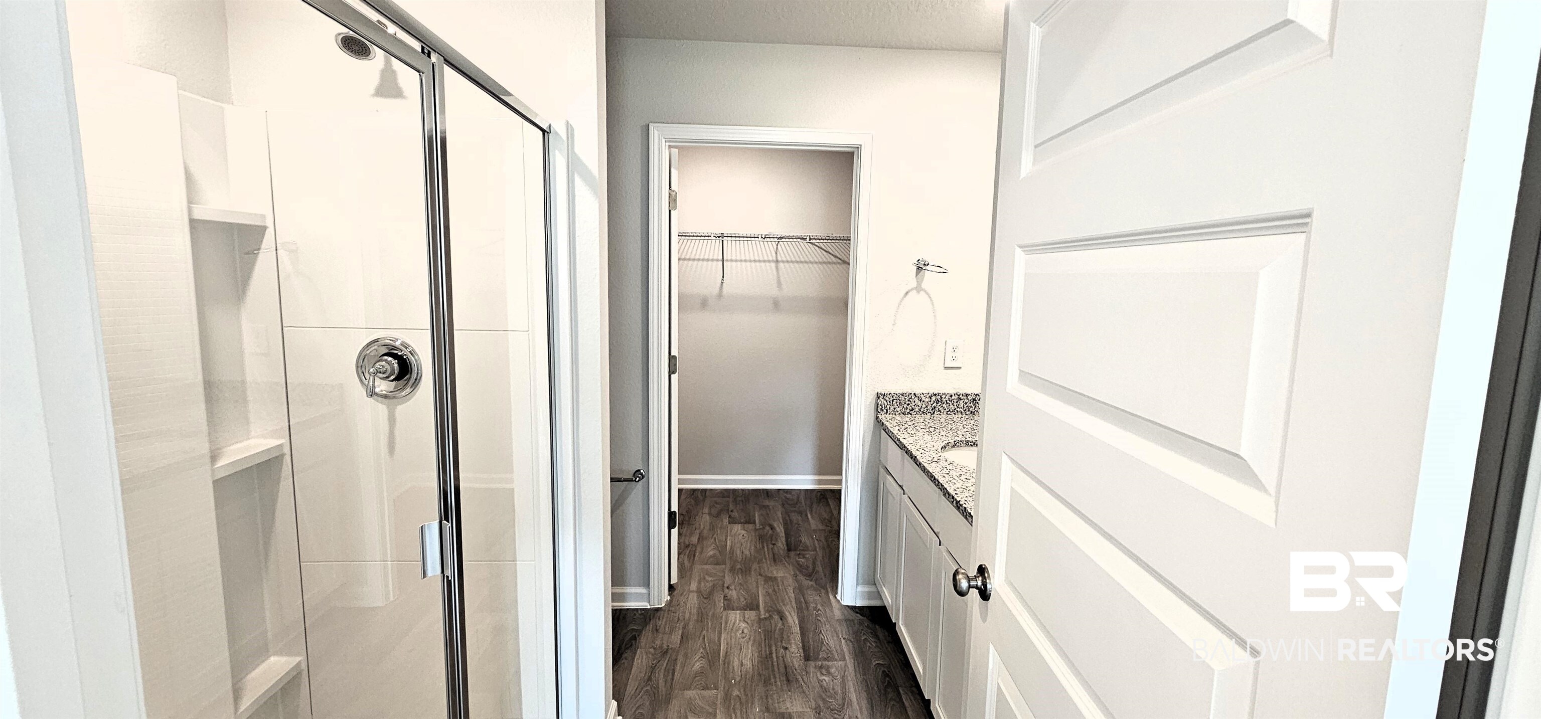 1144 Sweet Laurel Street Foley, AL 36535 - Photo 3 of 10 Bathroom featuring walk in shower, hardwood / wood-style flooring, and vanity