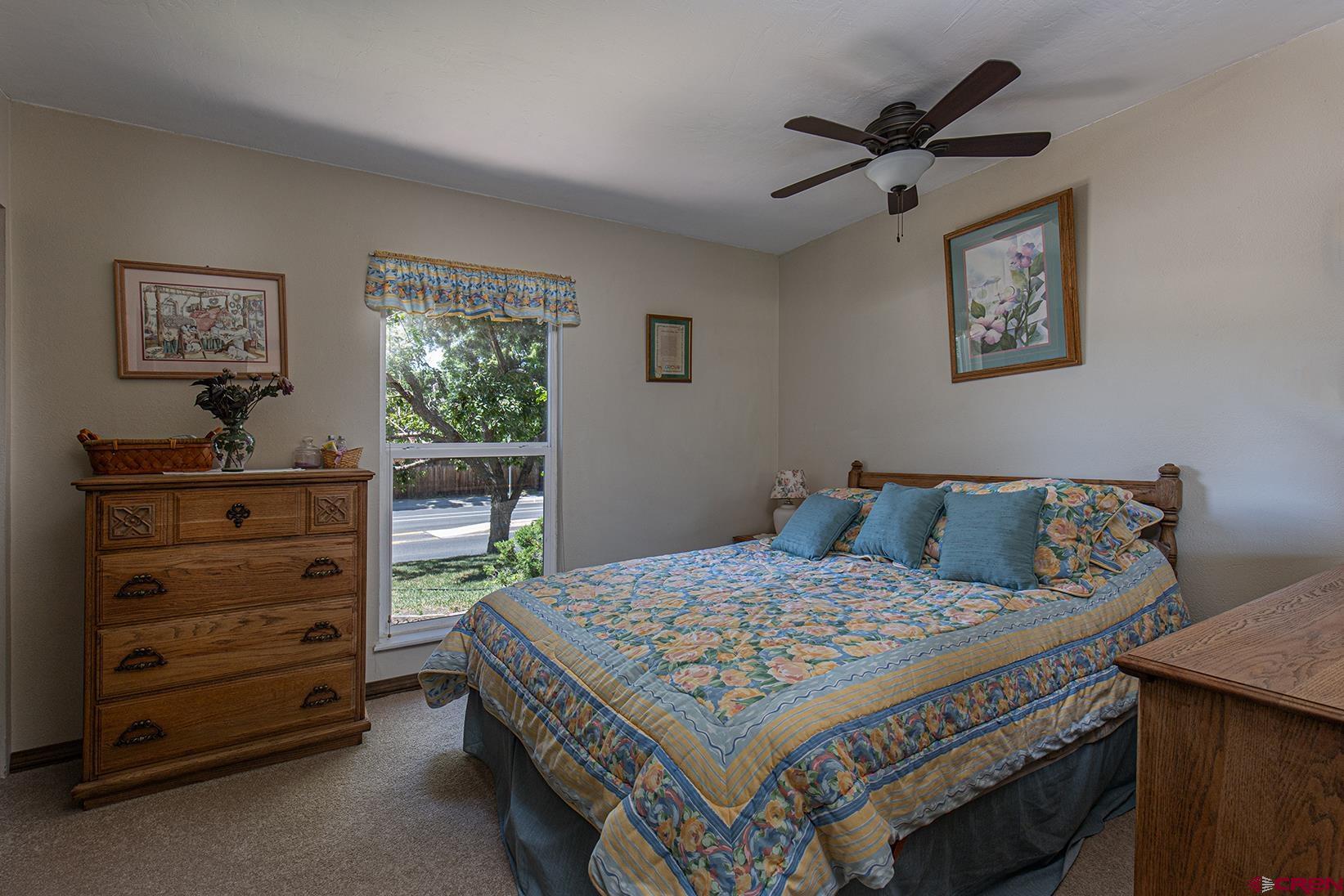 904 Florida Road Durango, CO 81301 - Photo 12 of 20 a bed room with a bed and a dresser
