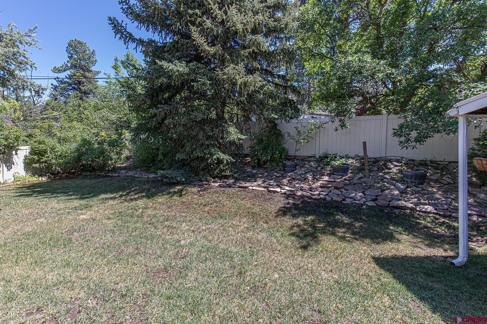 904 Florida Road Durango, CO 81301 - Photo 16 of 20 a backyard of a house with lots of green space