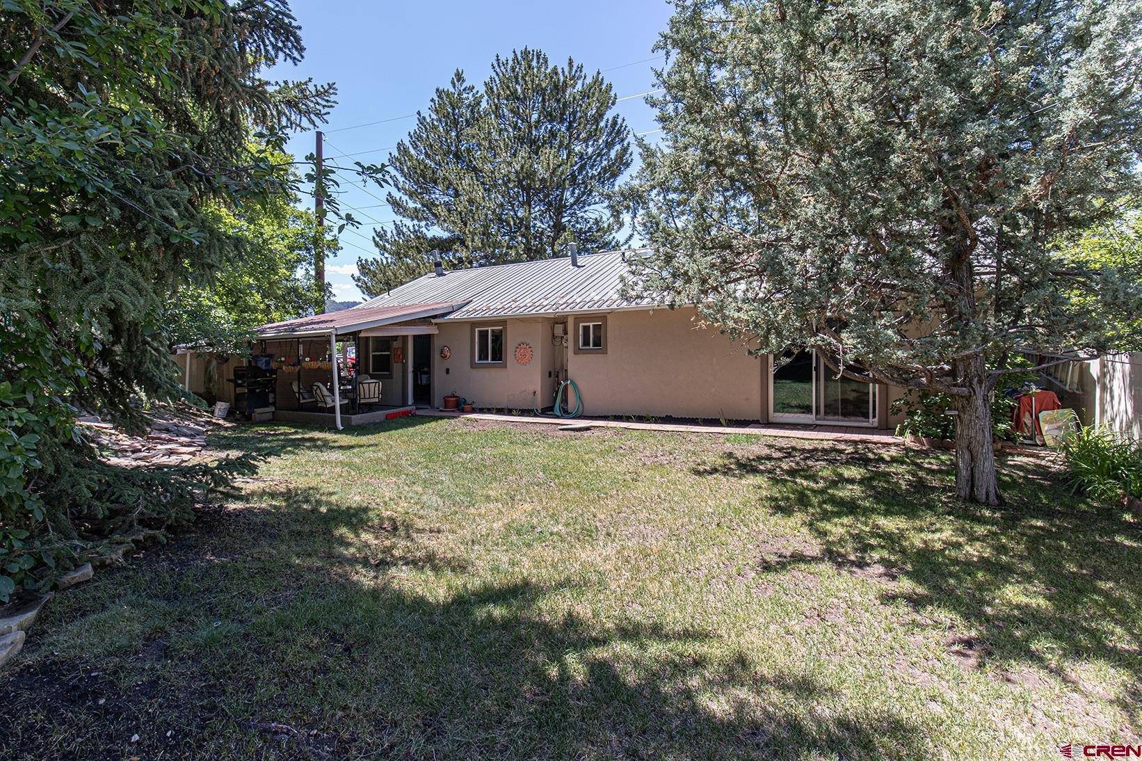 904 Florida Road Durango, CO 81301 - Photo 2 of 20 a front view of house with yard and trees