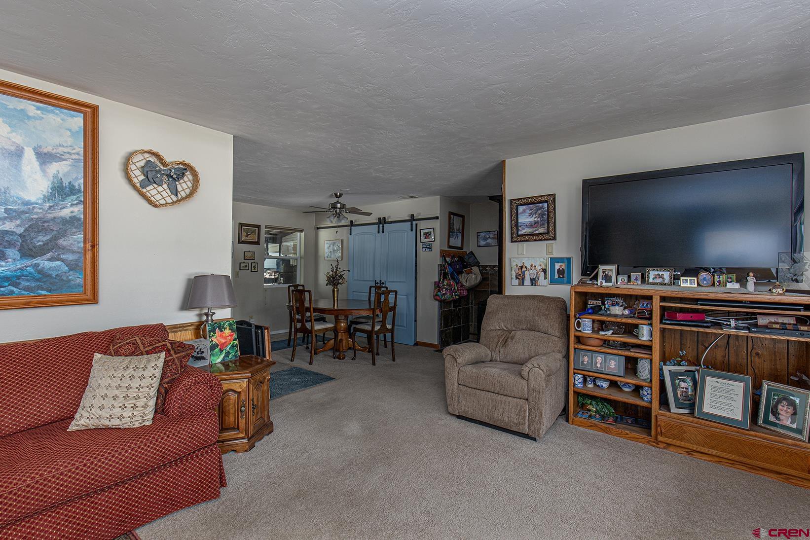 904 Florida Road Durango, CO 81301 - Photo 7 of 20 a living room with furniture and a flat screen tv
