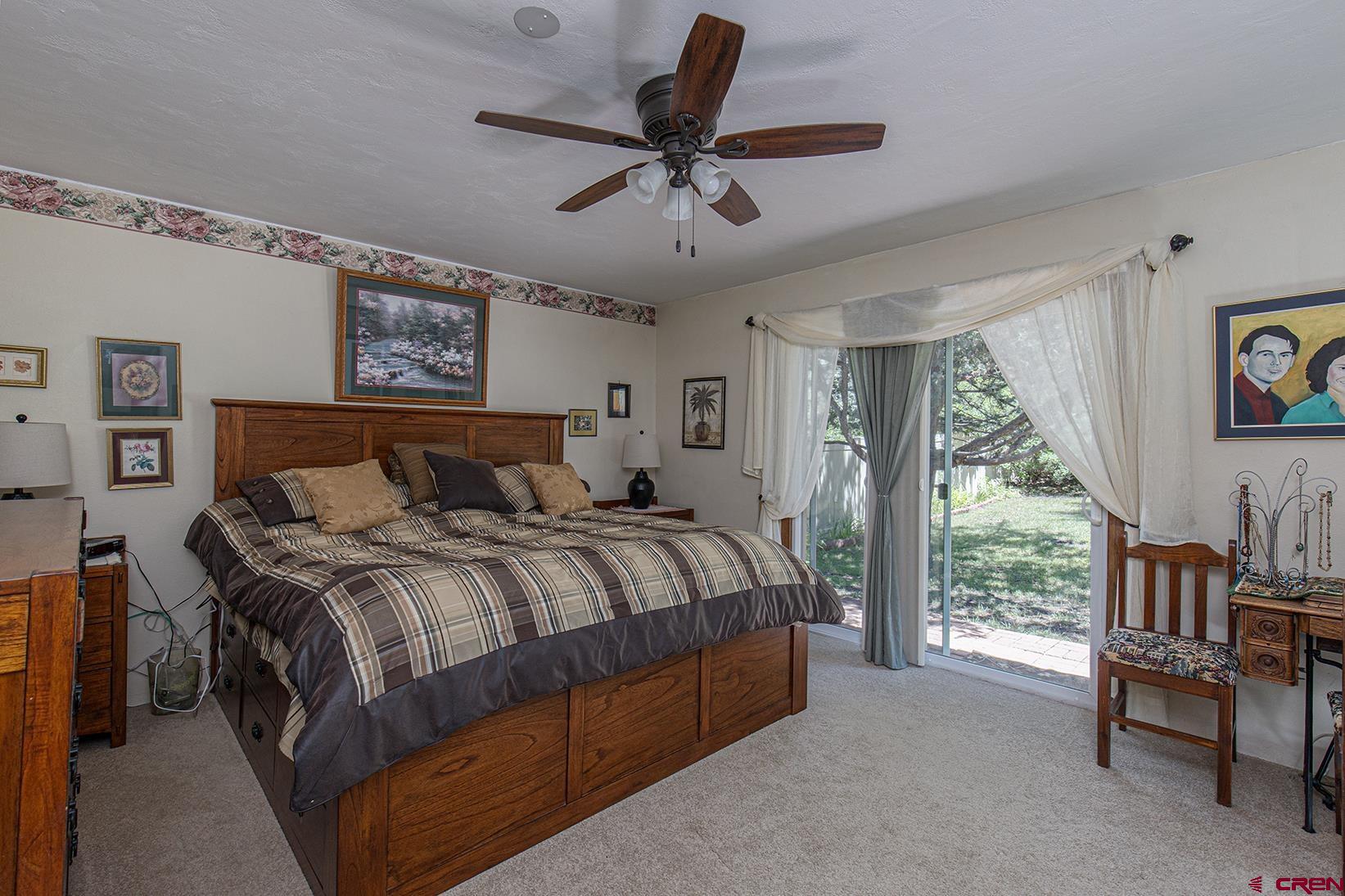 904 Florida Road Durango, CO 81301 - Photo 9 of 20 a bedroom with a bed and a large window