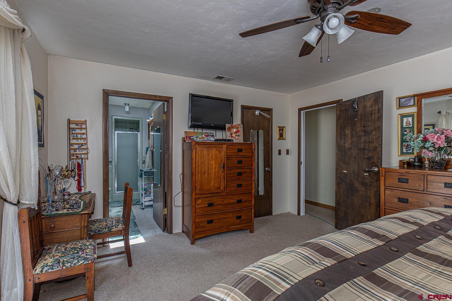 904 Florida Road Durango, CO 81301 - Photo 10 of 20 a bedroom with a bed and a dresser