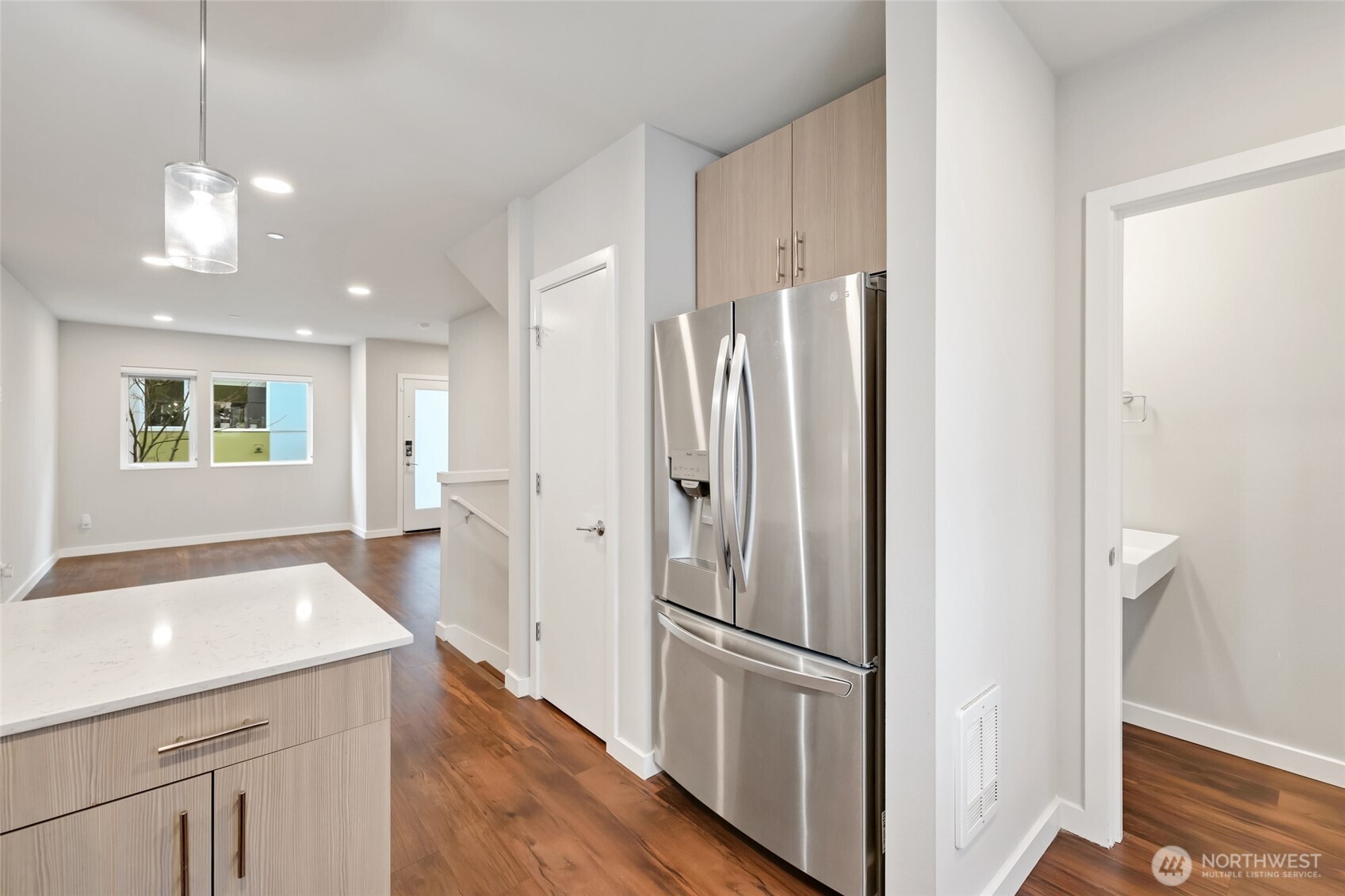 12522 15th Avenue Northeast, Unit B Seattle, WA 98125 - Photo 12 of 40 a kitchen with stainless steel appliances a refrigerator and a sink