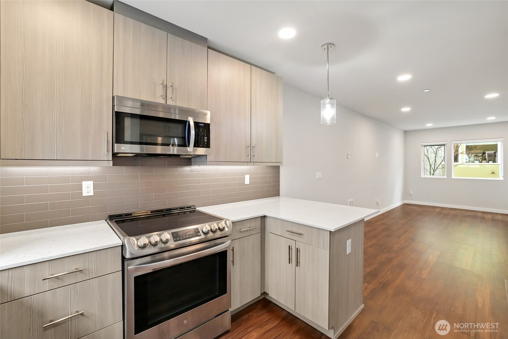 12522 15th Avenue Northeast, Unit B Seattle, WA 98125 - Photo 13 of 40 a kitchen with a stove and a microwave